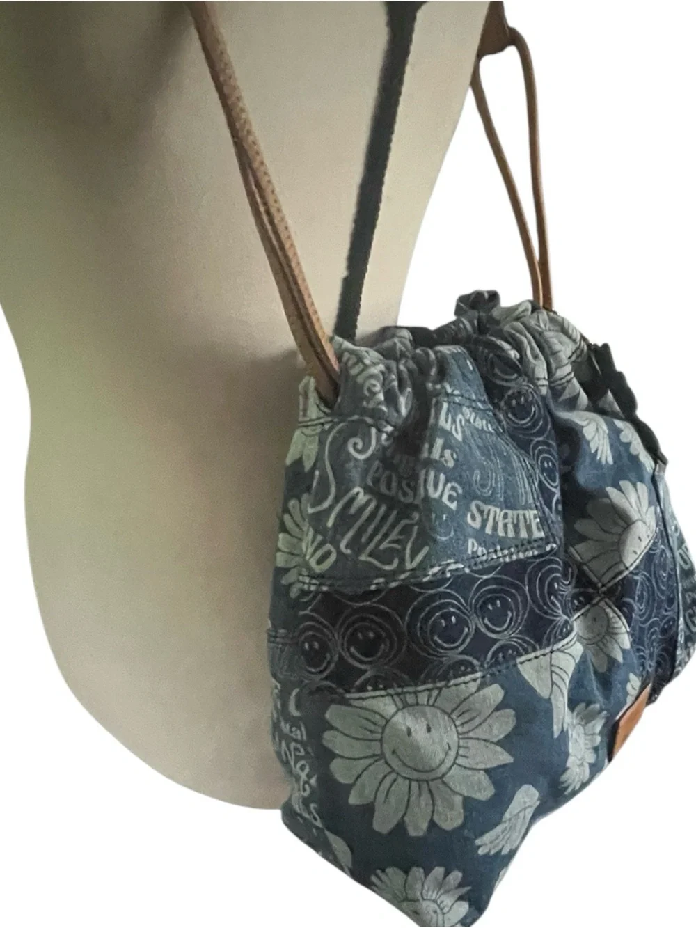 Fossil x Smiley limited edition patchwork denim drawstring shoulder bag.